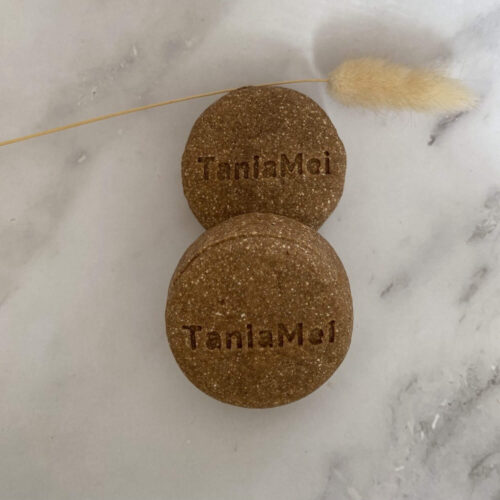 brown round shampoo bar with taniamei logo