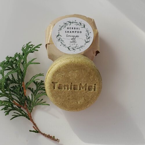 round green shampoo bar with taniamei logo