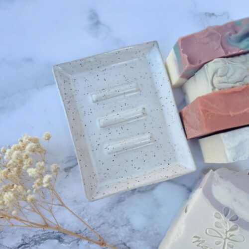 Ceramic soap tray beige on a display table