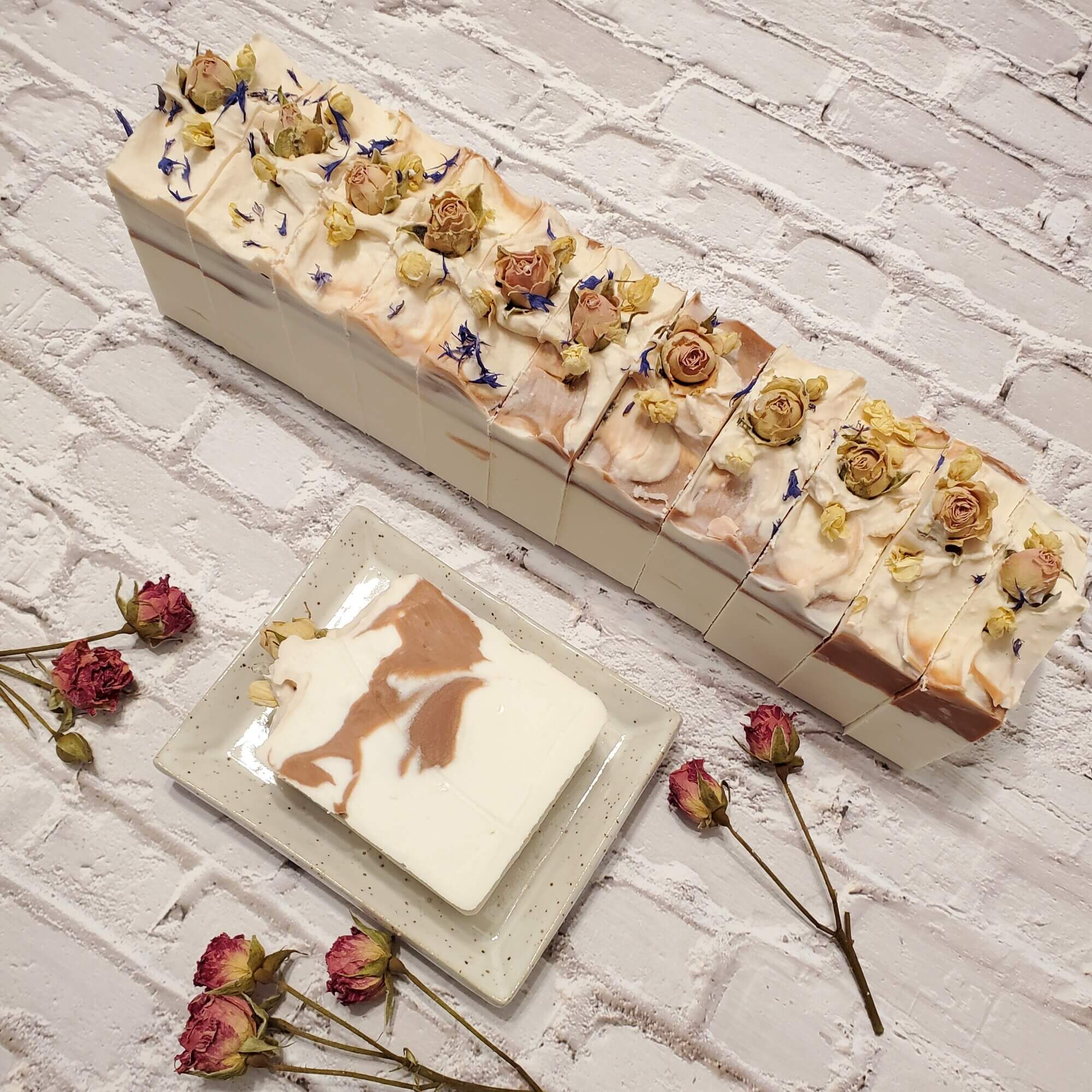 white and pink soap bars with rose buds