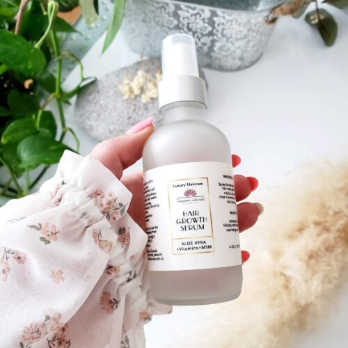 glass bottle with liquid serum and atomizer